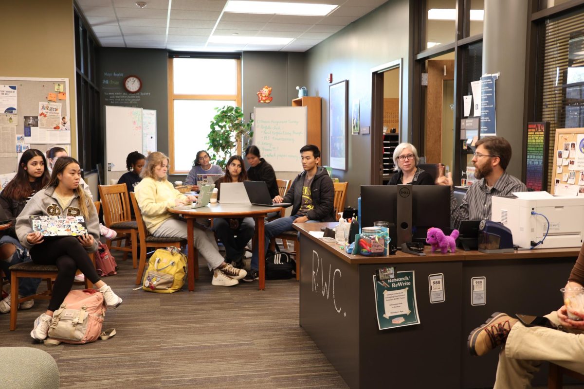 Reading/Writing Center Director, Lucas Street (right), talks at the RWC all-staff meeting on Oct. 17, 2024.