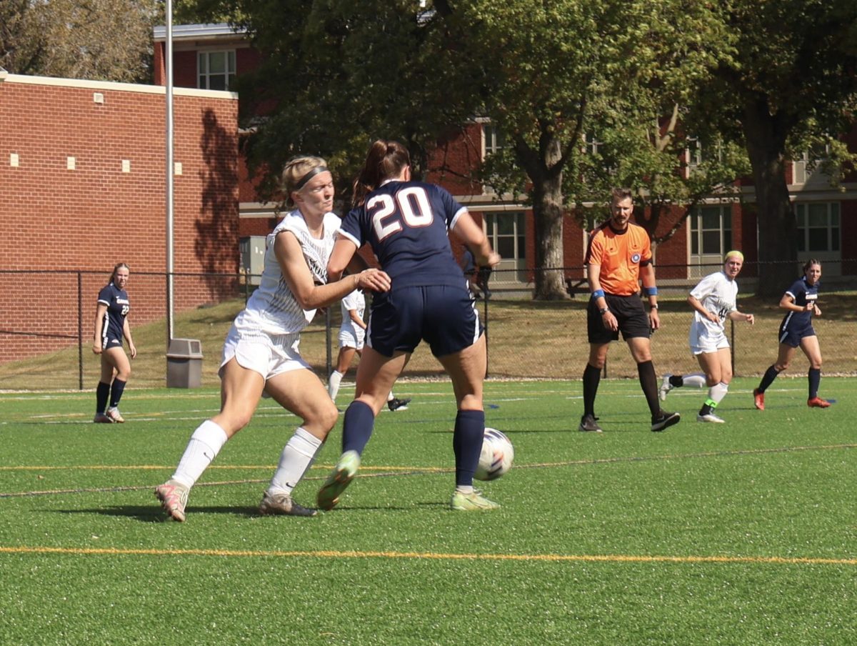 First-Year Mary Baker blocks Samantha Champney of Carroll University on Oct. 5th, 2024.