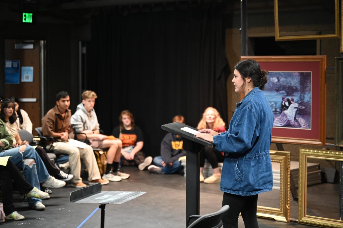 Sophomore Adilene Hernandez reads a combination of famous and self-written poetry in the Brunner Black Box Theater on Oct. 9.