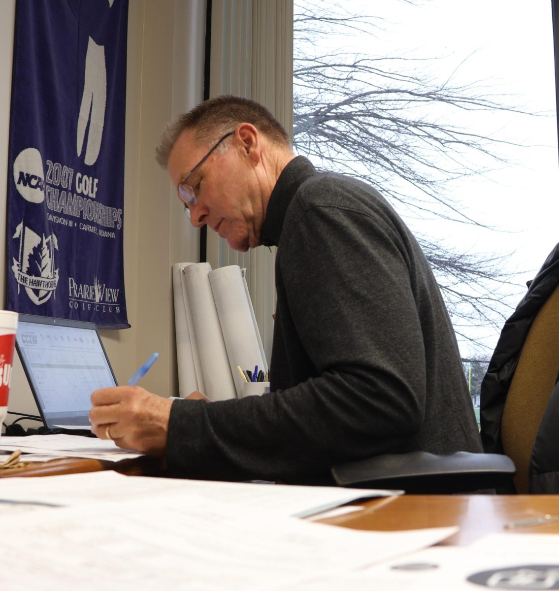 Mike Zapolski, Augustana College's Athletic Director, works in his office in Carver Physical Education Center on Nov. 21, 2024. Zapolski is in the midst of his 17th year as the Director of the College’s 28 athletic programs.