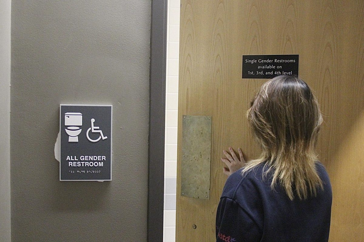 First-Year Lucien Dong enters one of the all-gender restrooms on the second floor of the Thomas Tredway Library at Augustana College. Students can also use single-gender restrooms on the library's 1st, 3rd and 4th floors.