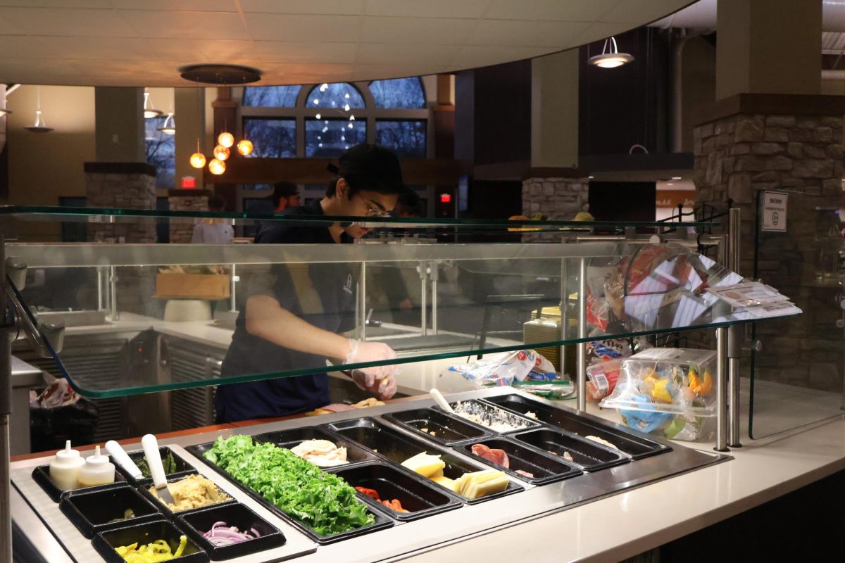 First-Year Faizan Pal prepares sandwich condiments at The Gerber Center on Nov. 6.