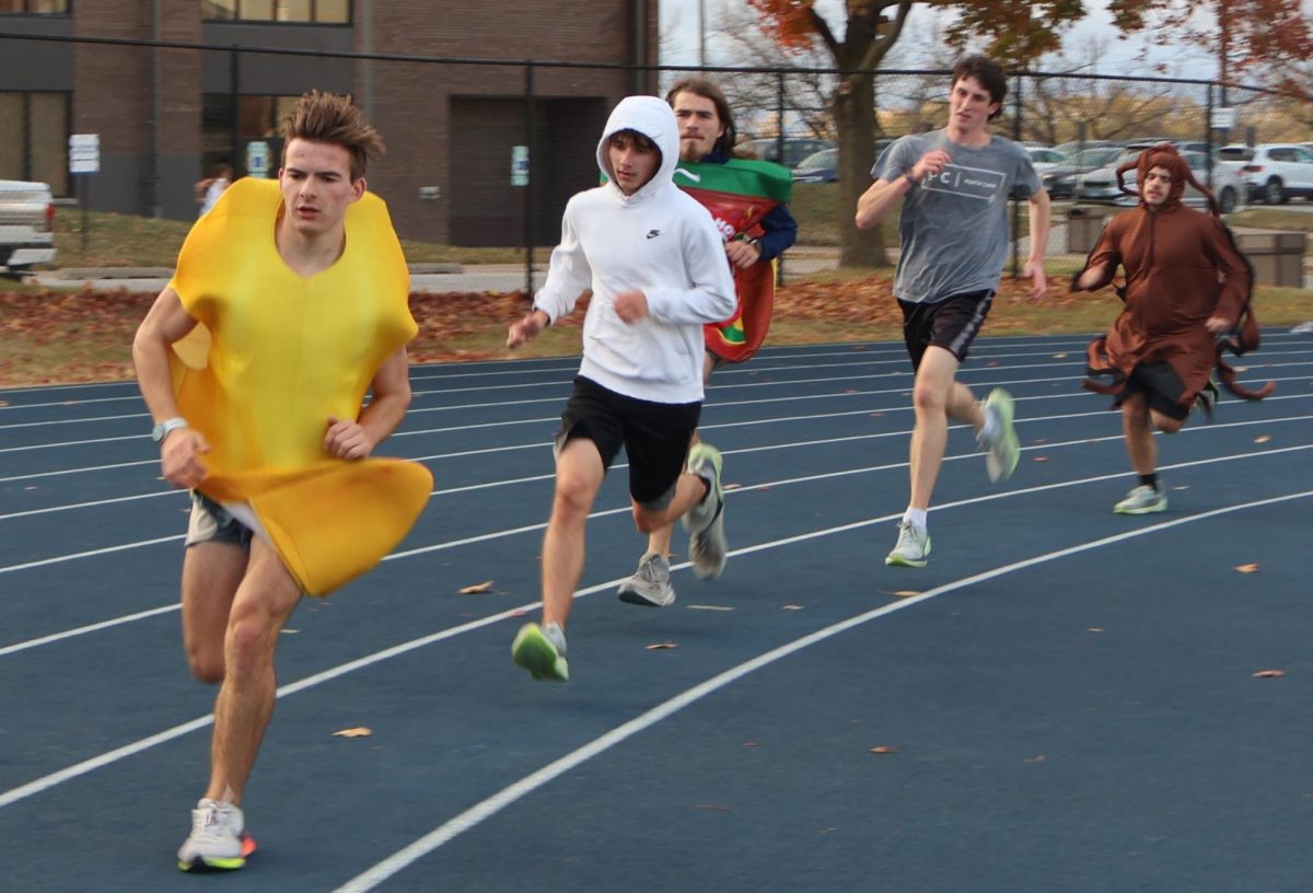 The Augustana College’s Men Cross Country team runs laps around the track at Erickson Field outside the Carver Center at 5 p.m. on Oct. 31, 2024.