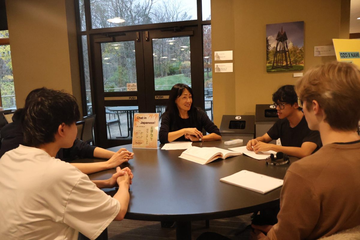 Augustana students participate in a Japanese speaking practice session with Miyuki Komura, a volunteer staff member, at The Brew on Nov. 14.