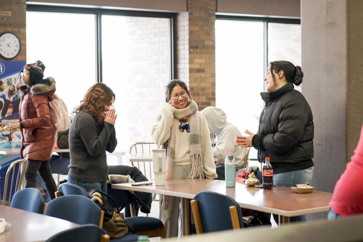 Students share a moment during lunch at Gus's Snack Bar, on a chilly February day at  Augustana.