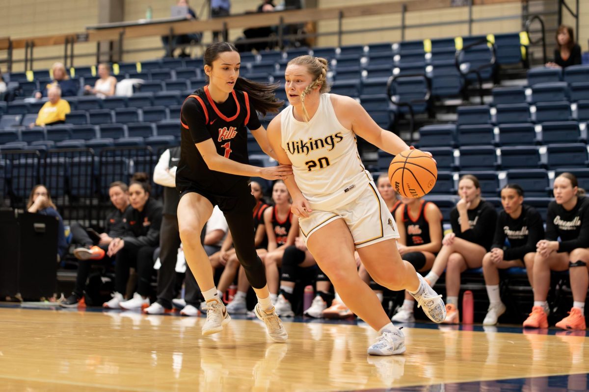 Senior Carly Stone drives past a Greenville defender during the Hyatt Place Tournament on Nov. 22, 2025 at Carver Center. The Augustana Vikings women's basketball team defeated the Greenville Panthers by a score of 66-45.