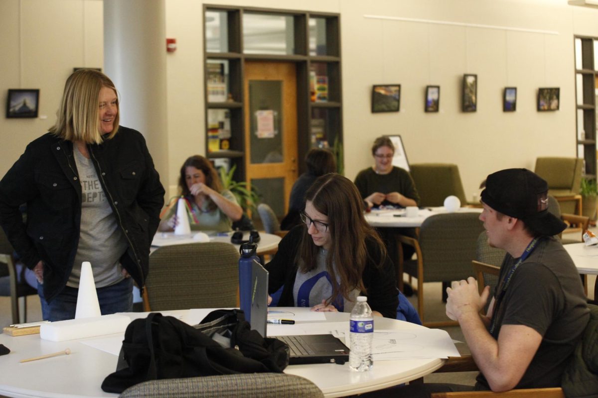 Participants engage in a speculative design workshop with Professor Vickie Phipps in Tredway Library on Nov. 7, 2025.