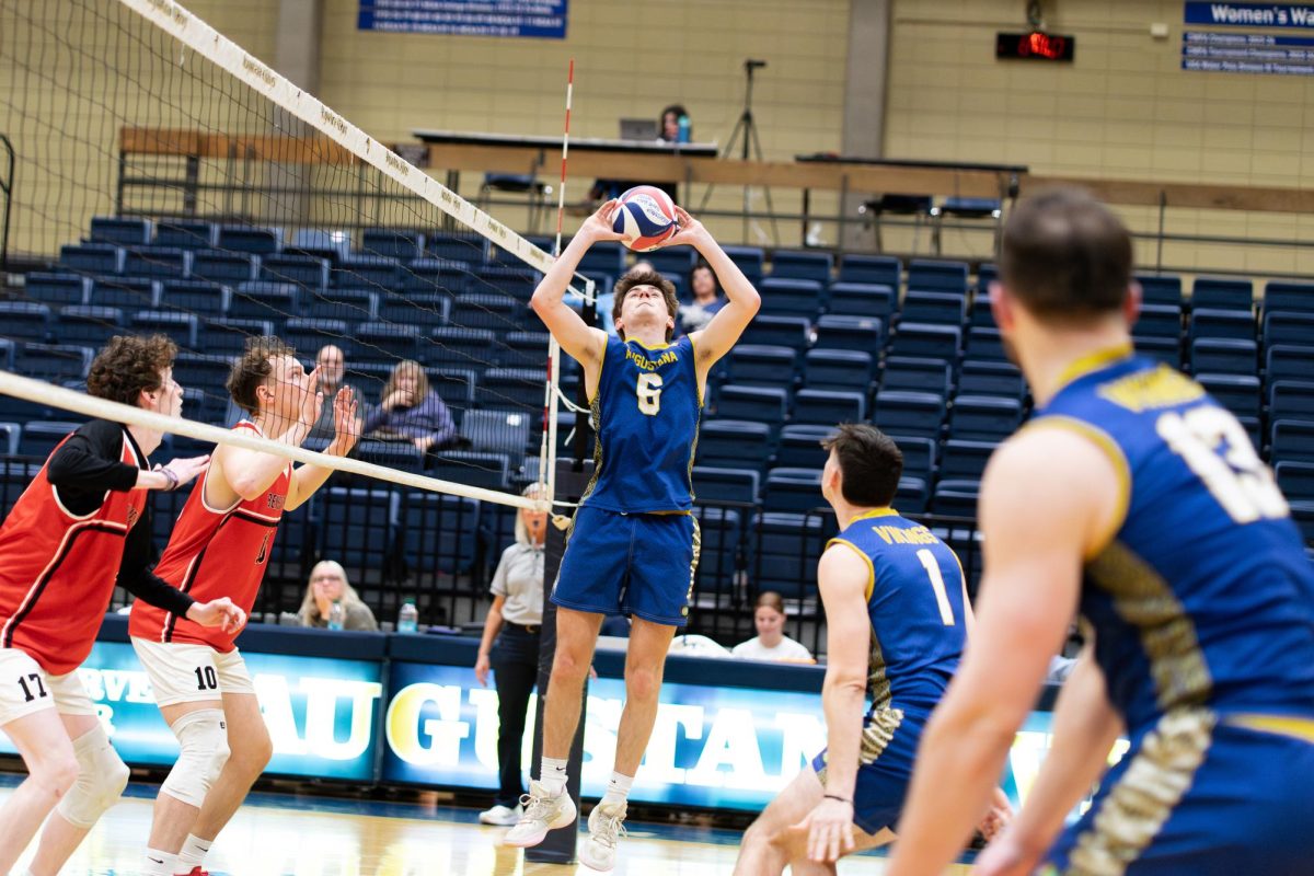 Junior setter Colin Schaefer sets the ball during Augustana's five-set home victory over the Benedictine Eagles on Feb. 10, 2026, at Carver Center. The Vikings secured the win 24–26, 25–23, 25–20, 20–25, 17–15.