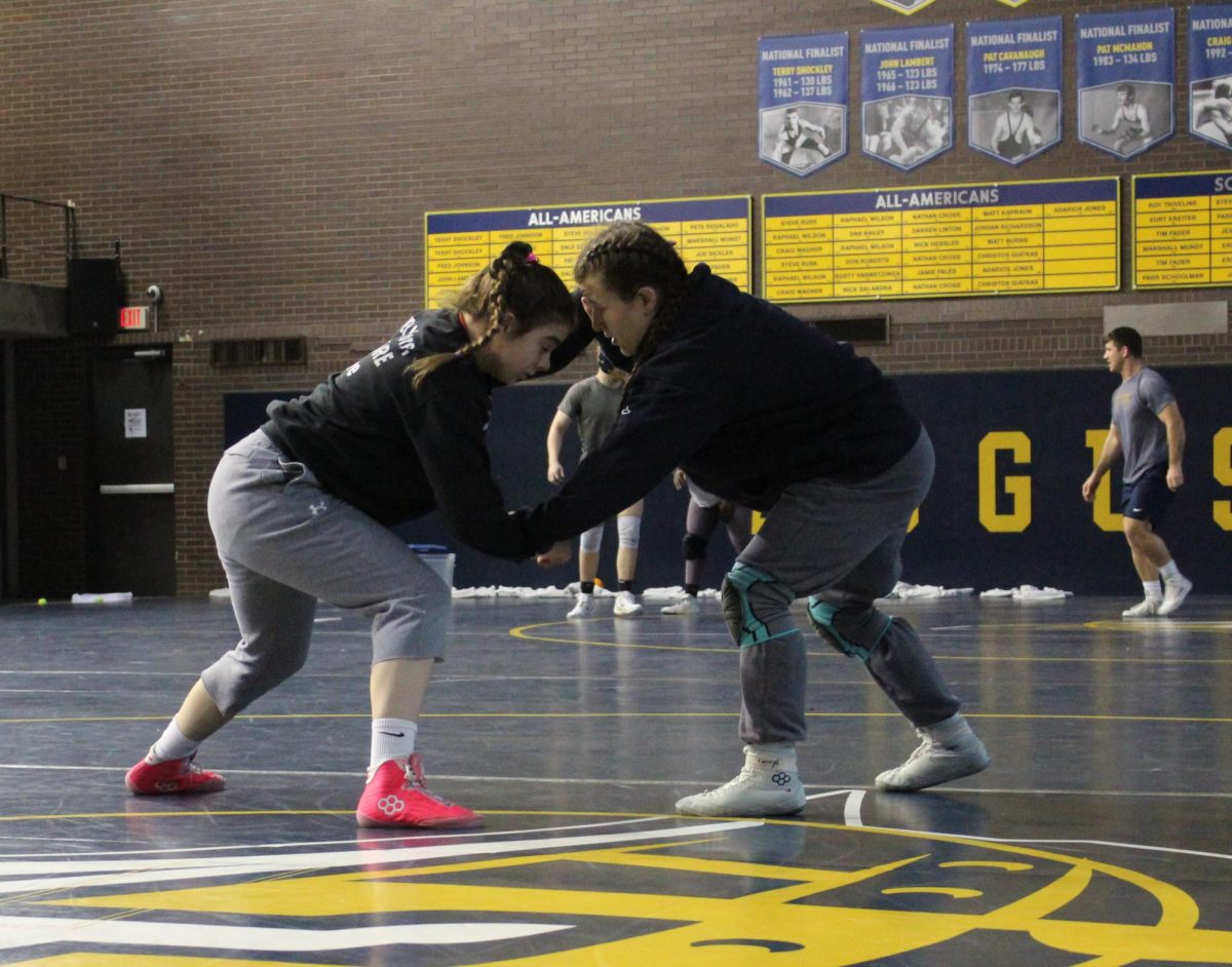 Senior Aine Moffit practices with Gia Ritter, sophomore, in the Carver Wrestling Arena on March 4, 2026. Moffit will compete at nationals after qualifying at regionals in third place. 
