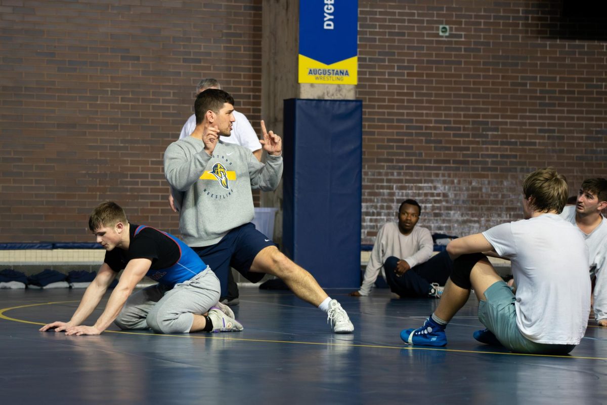 Head coach Tony Willaert instructs Gianni Panozzo during practice Tuesday at Carver Wrestling Facility ahead of the NCAA Men’s Wrestling Regional No.7. The Vikings finished 13th out of 15 teams, with two wrestlers placing in the top 10. 
