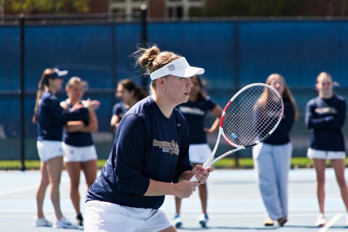 Senior Hannah Colbert readies for a return during Augustana's match against Loras on Saturday, April 19, 2026, at Lincoln Park. Colbert was honored on Senior Day, having previously recorded her 100th career win.
